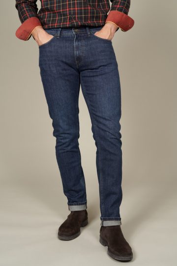 Jean stretch tapered délavé et cuir