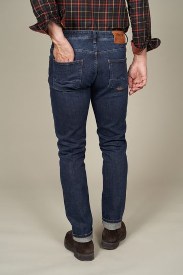 Jean stretch tapered délavé et cuir